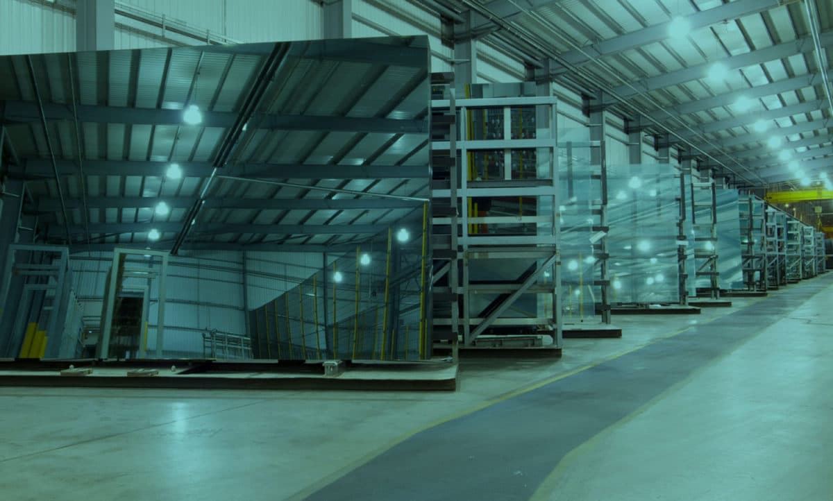 Glass stock stored in industrial racks inside the Pacific Glass warehouse